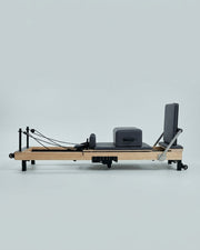 Reformer Pilates pliable Opilat coloris Charbon, vue de profil